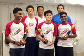 MADRID-BOUND: Fandi Ahmad (centre) with Yeo&#039;s vice-president of marketing May Ngiam (second from far left), ITE section head of physical education Ravindaran Ramasamy (second from far right) with the three winners, Sabran Abdul Rahman (far left), Tan Hoong Yuen and Kaviarasan Jayatheran  (far right).  