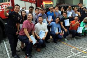 The 16 people who helped with efforts in rscuing a South Korean man pinned under a truck were given awards by the Singapore Civil Defence Force on Sunday (July 26).