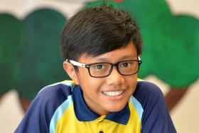 HARDY: Sec 2 student Muhammad Azri Rahmlan, 13, wins a resilience award for juggling schoolwork, football and caring for his wheelchair-bound father.