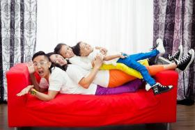 HAPPY: Mr Lawrence Koh and his wife Elina Ng and his children, Koh Yee, eight and Koh Zee, six.