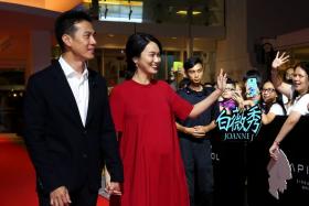 Joanne Peh and husband Qi Yuwu at the gala premiere of the movie &quot;1965&quot; last month. They welcomed a healthy baby girl on Friday. 