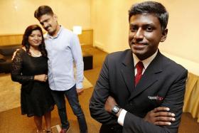 AWARD WINNER: Mr Daniel Ravindran and his parents, in the background.