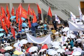 Supporters from Workers&#039; Party and Peoples&#039; Action Party gather at Serangoon Junior College for the 2013 by-election Nomination Day.