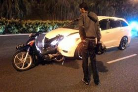 TRAGIC: (Above) Scene of the accident on the Seletar Expressway. An injured and bloodied Mr Helmee.