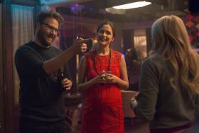 Rose Byrne (centre) with Seth Rogen (left) and Chloe Grace Moretz (right) in Bad Neighbours 2.