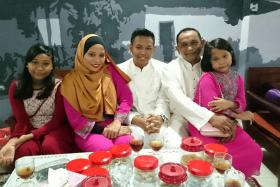 HEARTBROKEN: Mr Farid (second from right), his wife Madam Nurlina Salim (second from left) and their three children. 