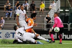 OPENER: Albirex&#039;s Tatsuro Inui (in orange) scoring their first goal despite the attention of Warriors&#039; Syaqir Sulaiman.