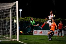 UNSTOPPABLE: Home United goalkeeper Zulfairuz Rudy unable to keep out Albirex from scoring.