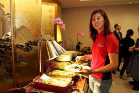 THUMBS UP: Sailor Jovina Choo (above) is happy with the dishes at the food tasting at the Pan Pacific Hotel yesterday.