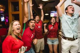 FINALLY: Portugal fans celebrating their team&#039;s first major triumph at the McGettigan&#039;s bar at Clarke Quay yesterday morning.  