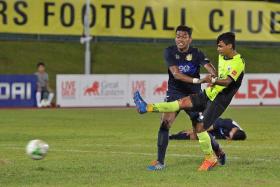 BRIGHT START: Saifullah Akbar (in yellow) marking his professional debut with a goal.