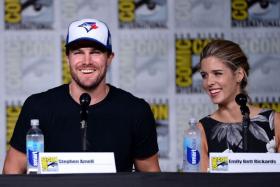 SAN DIEGO, CA - JULY 23: Actors Stephen Amell (left) and Emily Bett Rickards (right) attend the &quot;Arrow&quot; Special Video Presentation and Q&amp;A Comic-Con International 2016 at San Diego Convention Center on July 23, 2016 in San Diego, California. 