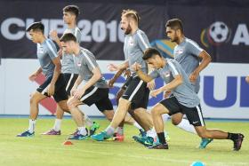 RARING TO GO: The Singapore Lions preparing for tonight&#039;s match.  