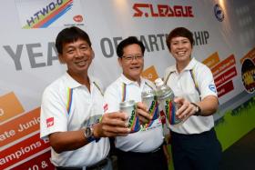 (From left) S.League chief executive officer Lim Chin, Football Association of Singapore (FAS) vice-president Lim Kia Tong and Yeo Hiap Seng (Singapore) 1st vice-president May Ngiam raising a toast for youth football at a sponsorship event at Jalan Besar Stadium on 5 March 2016.