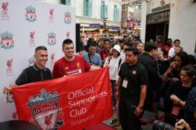 Former Liverpool player Luis Garcia posing for photos during the official launch of the Liverpool FC Store at Bugis Junction on Friday (Jan 10).