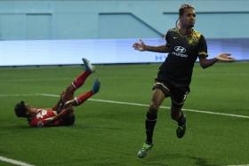 Tampines Rovers forward Jordan Webb wheels away after making it 2-2. 