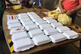 Packets of food delivered to migrant workers staying in dormitories by volunteers under the Covid Migrant Support Coalition&#039;s initiative