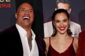 Dwayne Johnson and Gal Gadot at the premiere for Red Notice in Los Angeles on Nov 3, 2021.