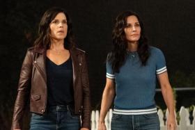 Original cast members Neve Campbell (left) and Courteney Cox reunite in the latest installment of Scream.