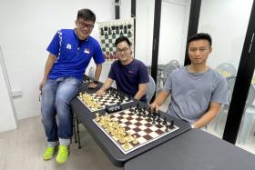 (From left) Singapore Chess Federation vice-president Kevin Goh with chess enthusiasts Zhang Changjie and Zhang Taiyang.
