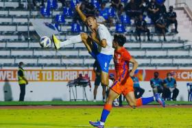 Lion City Sailors&#039; Kim Shin-Wook in action with Shandong Taishan&#039;s Zhang Yingkai. 