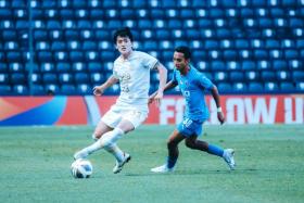 Lion City Sailors' Faris Ramli (right) chases down Daegu FC's Hong Chul at Buriram Stadium on April 30, 2022.