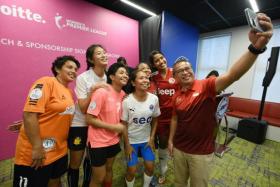 Minister Edwin Tong (right) with players at the launch of the Deloitte Women&#039;s Premier League on May 4, 2022. 