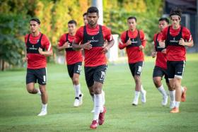 Team Captain Hariss Harun (centre) says the Lions believe they can take on higher-ranking opponents and hurt them. 