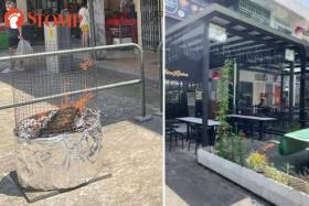 Flying ashes from Hungry Ghost burnt offerings drive away outdoor diners at Jalan Kayu