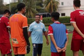 Coach Akbar Nawas (centre) instructing players in training at Toa Payoh Stadium on Feb 22, 2022. 
