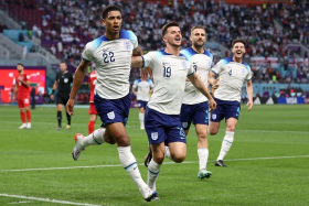 England midfielder Jude Bellingham (left) celebrates scoring his team&#039;s first goal in Doha on Nov 21, 2022. 