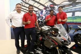 (Left to right) Mr Sharad Mohan Mishra, president group strategy at TVS, Mr Vimal Sumbly, head business premium, Mr J Thangarajan, president director, and Mr Herbert Teh, director of Motor Sport posing with the Apache RR310 at the TVS showroom in Ubi on Nov 24, 2022. 


