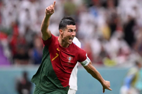 Cristiano Ronaldo celebrating after scoring his team's first goal during the Qatar 2022 World Cup Group H football match between Portugal and Uruguay at the Lusail Stadium on Monday. 
