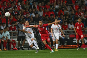 Singapore&#039;s Ilhan Fandi advancing with the ball in the first half before coming down with an injury. 
