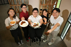 Temasek Polytechnic students (from left) Cheryl Pow, Jacob Ang, Kathleen Tay, Annabel Teo and Benedict Lim with the local dishes they recreated using plant-based proteins. ST PHOTO: LIM YAOHUI
