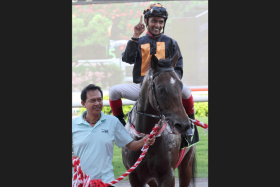 Jockey A&#039;Isisuhairi Kasim bringing Mr Black Back to the winner&#039;s circle after their last-start victory on June 11. Then trained by Tim Fitzsimmons, it was the five-year-old&#039;s third win in nine starts at Kranji. ST PHOTO: SHAHRIYA YAYAHA