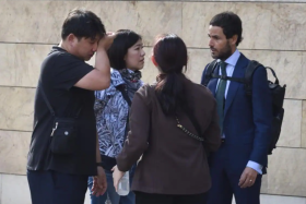 Ms Audrey Fang&#039;s family members with lawyer Manuel Martinez.