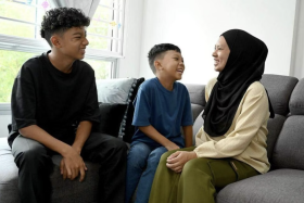 Ms Normalah Mohd Sidek with her sons Muhammad Reezqy Danish Mohammad Azhar, nine, and Muhammad Reezqy Matin Mohammad Azhar, 14.