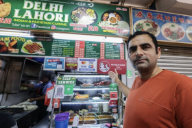 Mr Naseer Ahmed Khan at his Delhi Lahori stall in Tekka.