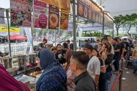 People are willing to queue for hours to buy tubs of kunafa.