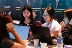 Participants of YouthxHack 2024 harnessing technology to tackle one of the three problem statements they were presented with.