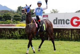 Apprentice jockey Syafifie Zailuddin all smiles as he brings Ahtims Klis back to the winner&#039;s enclosure in Race 2 at Ipoh on Jan 5.
