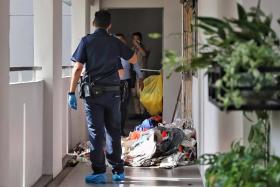 Some items, believed to have been cleared from the unit, were scattered outside the flat. 