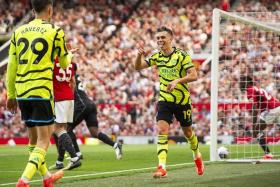 Leandro Trossard of Arsenal celebrates scoring the 0-1 goal with his teammtae Kai Havertz (left) who assisted the goal.