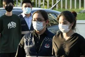 Pansuk Siriwipa (far right) was given 168 new charges charges while her husband, Pi Jiapeng (far left) was handed two new charges.