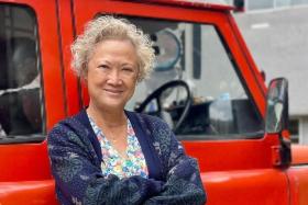 Actress Hong Huifang sports make-up to age herself and curly white hair to play a grandmother in the Malaysian production.