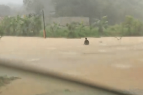 The father trudged through murky flood waters to get baby essentials.