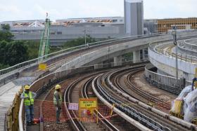 Work being carried out on Dec 8 on the Tanah Merah viaduct to connect tracks from the East-West Line to the new East Coast Integrated Depot.