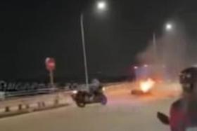The Singaporean&#039;s motorbike collided with a car that was making a U-turn, and the bike subsequently caught fire.