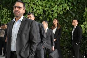 WP chief Pritam Singh queueing at the State Courts ahead of his hearing on Nov 6.